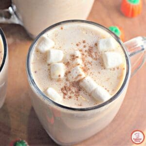 Boozy pumpkin white hot chocolate in a cozy mug