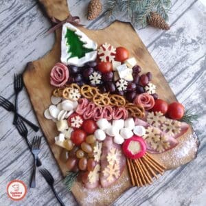 Christmas grazing board filled with meats and cheeses for holiday parties