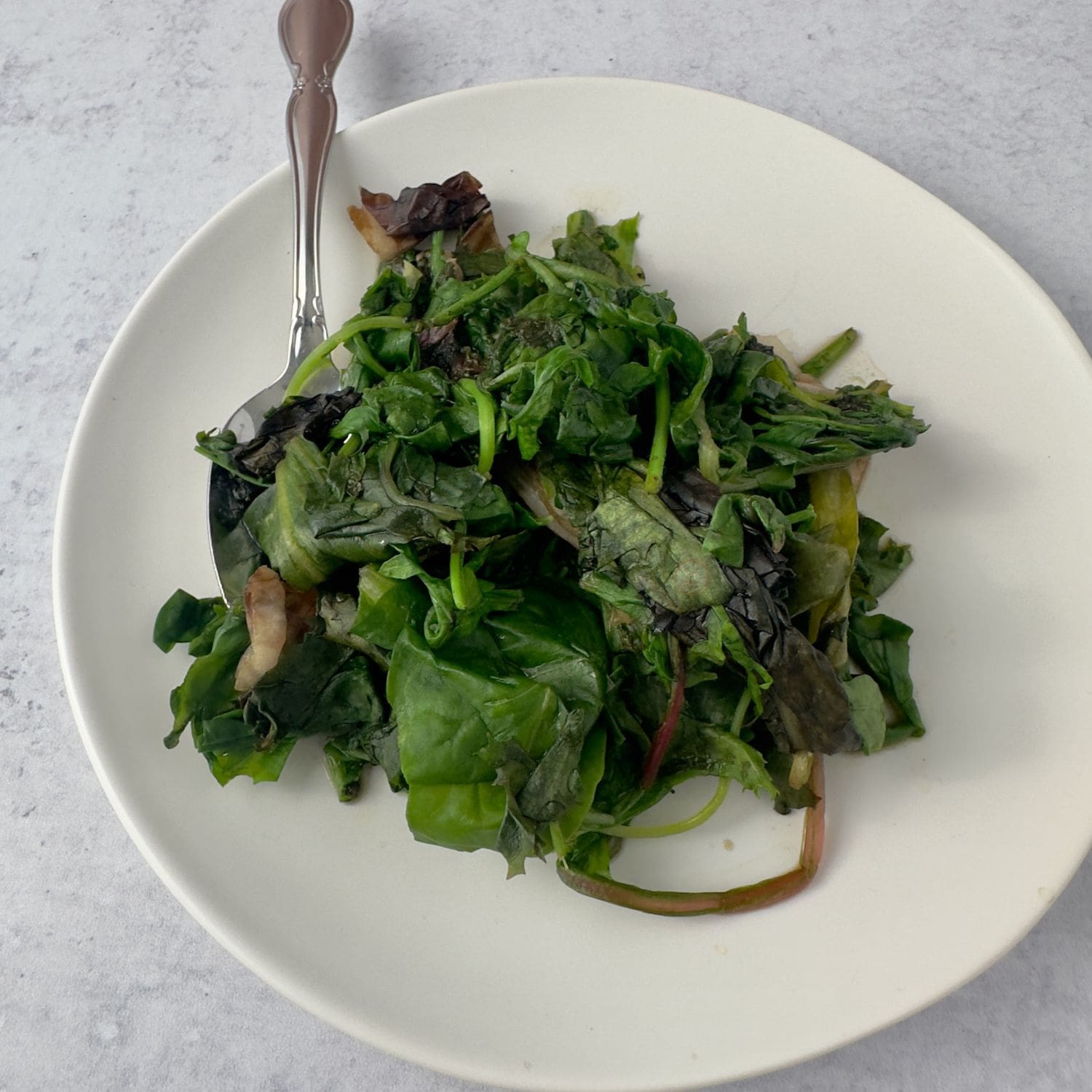 A vibrant dish of sautéed baby greens, perfect for a healthy side.