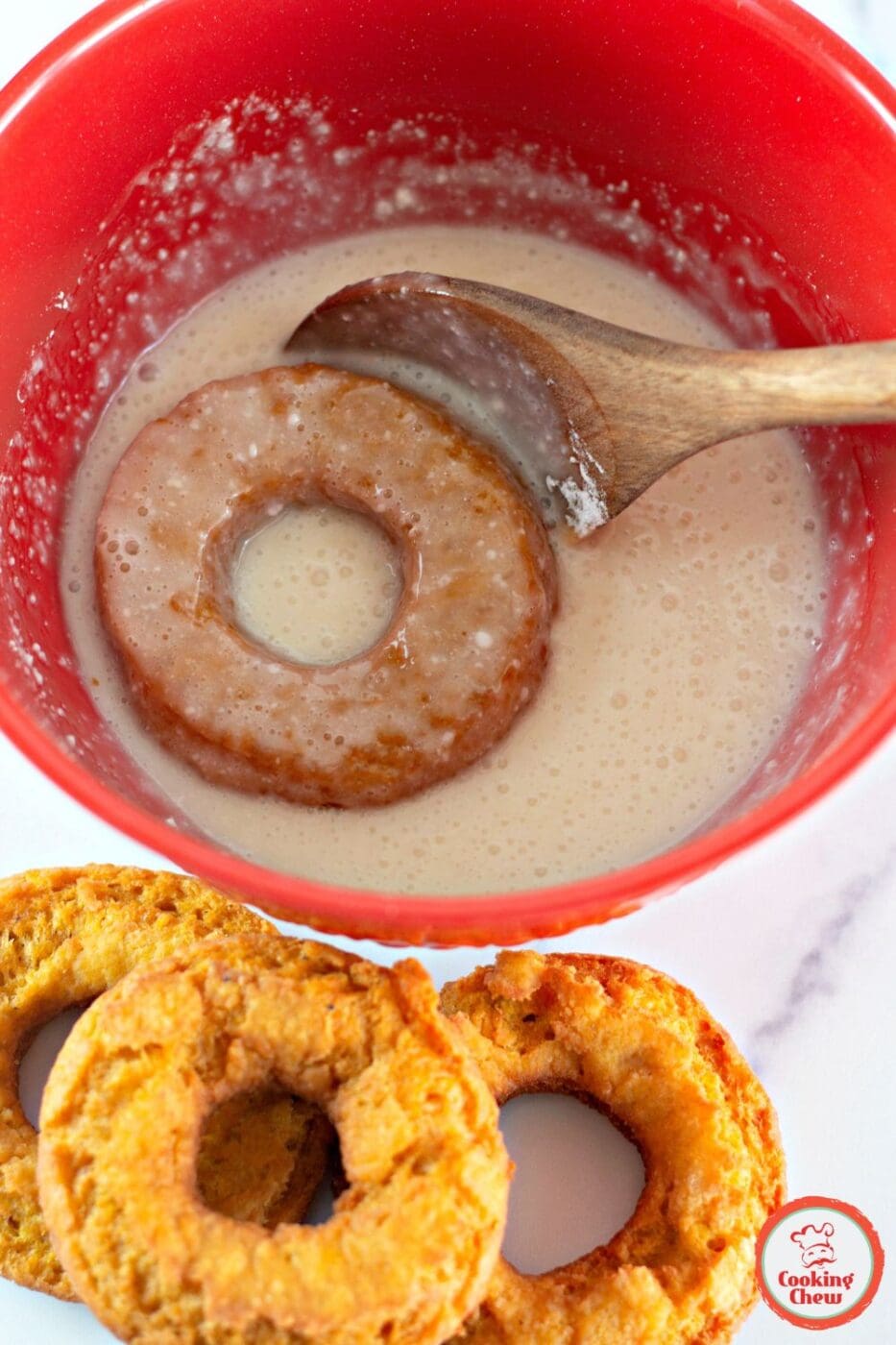 Homemade pumpkin donuts with a vanilla buttermilk glaze.