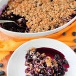 A delicious blueberry maple crisp topped with a golden crumble, the perfect dessert for any occasion.