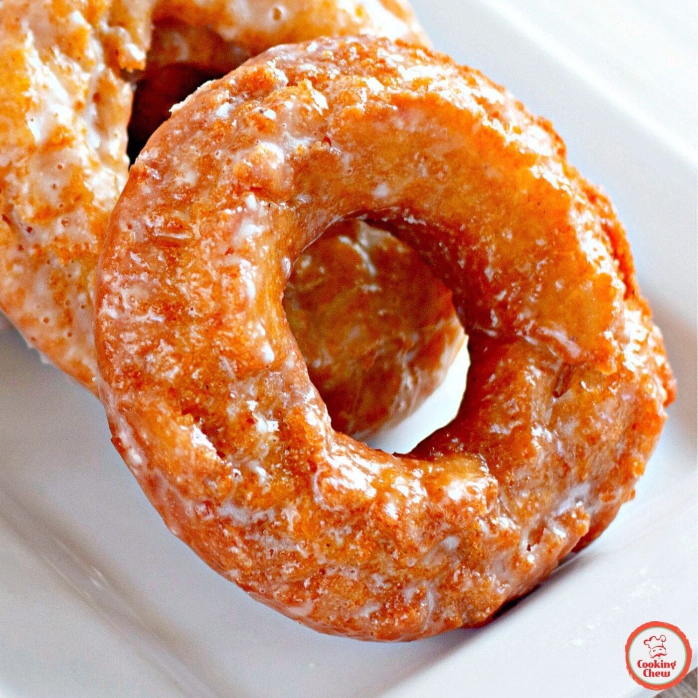 Warm pumpkin spice donuts with vanilla glaze.