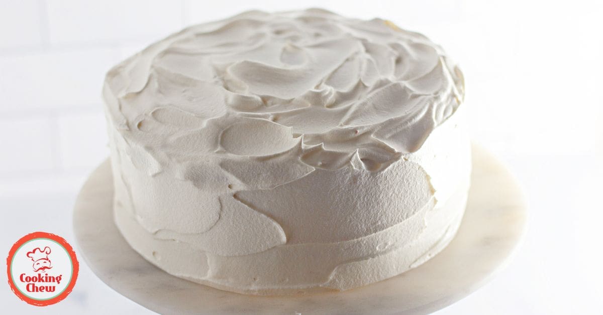 Close-up of a Christmas Jello cake slice showing vibrant layers and a whipped topping.