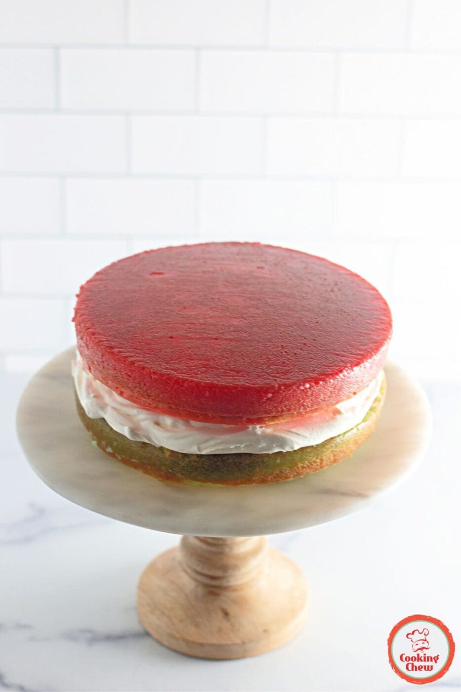 A festive Jello cake centerpiece surrounded by holiday decorations.