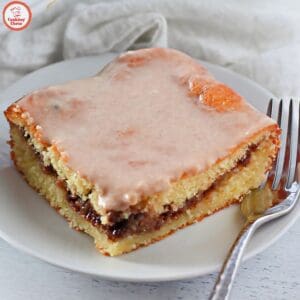 Cinnamon swirl cake with a soft texture and rich glaze.