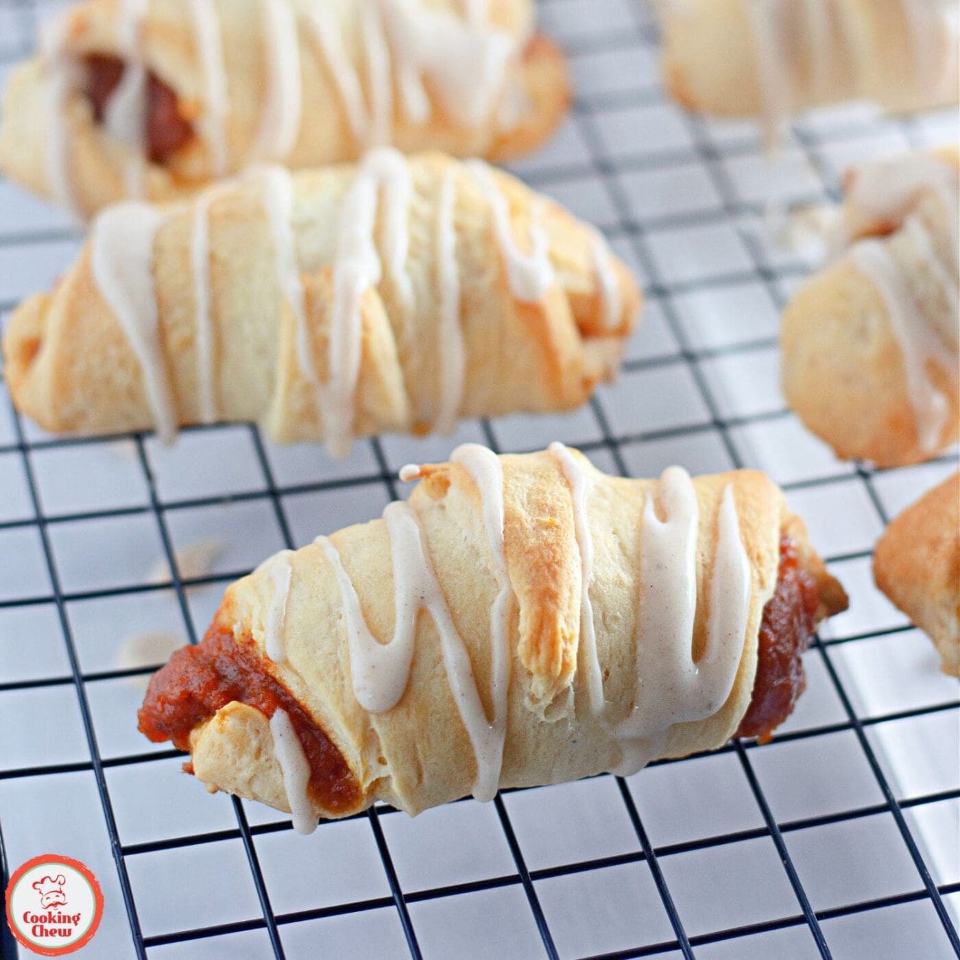 Golden crescent rolls filled with spiced pumpkin, ideal for autumn.