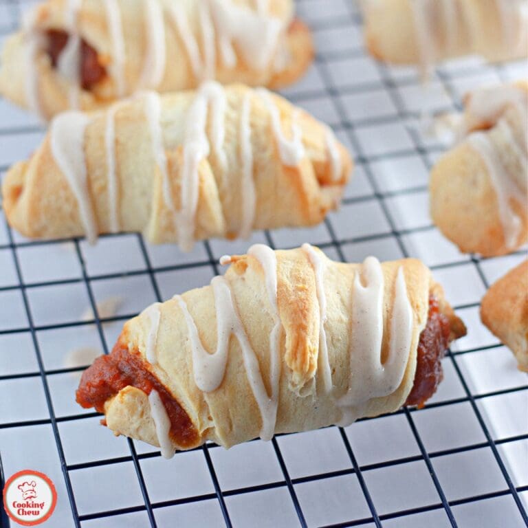 Golden crescent rolls filled with spiced pumpkin, ideal for autumn.