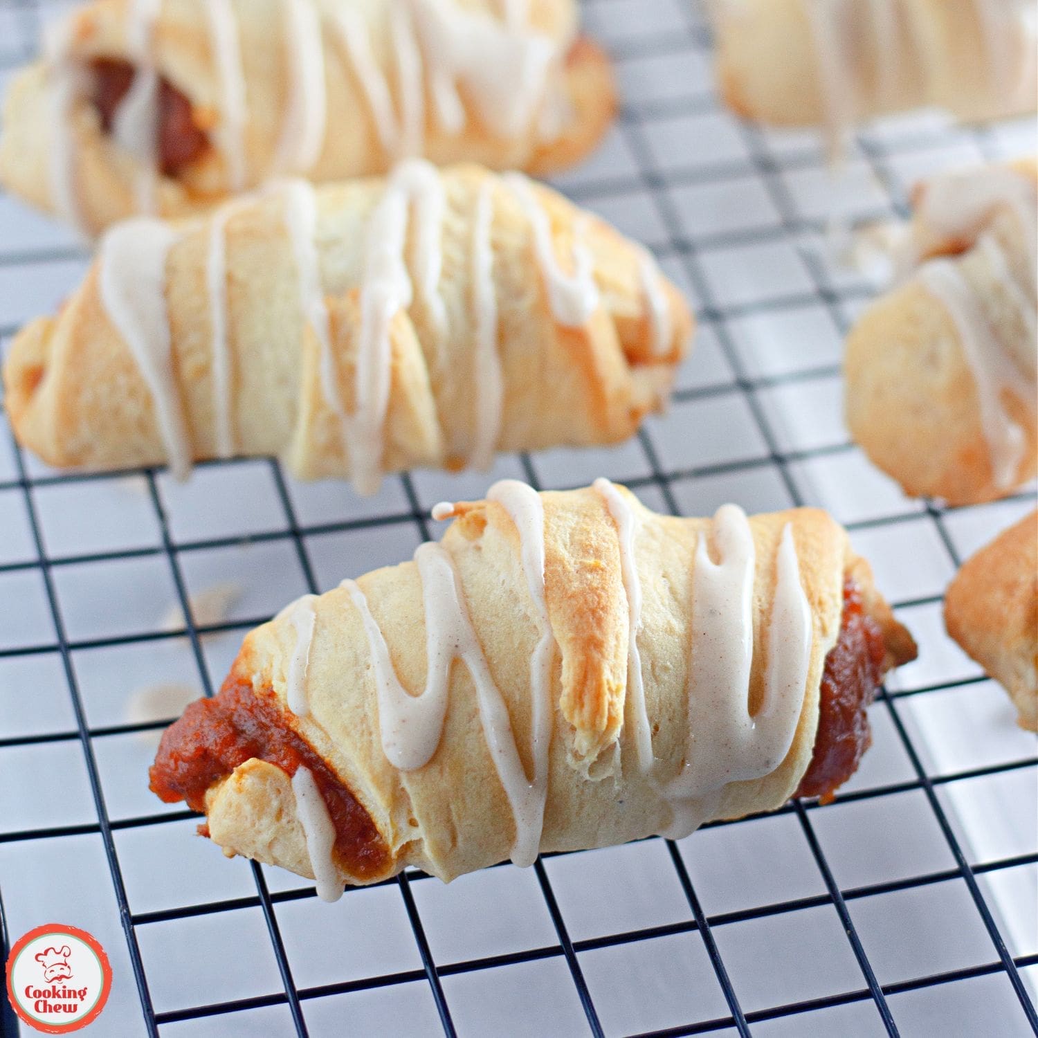 Golden crescent rolls filled with spiced pumpkin, ideal for autumn.