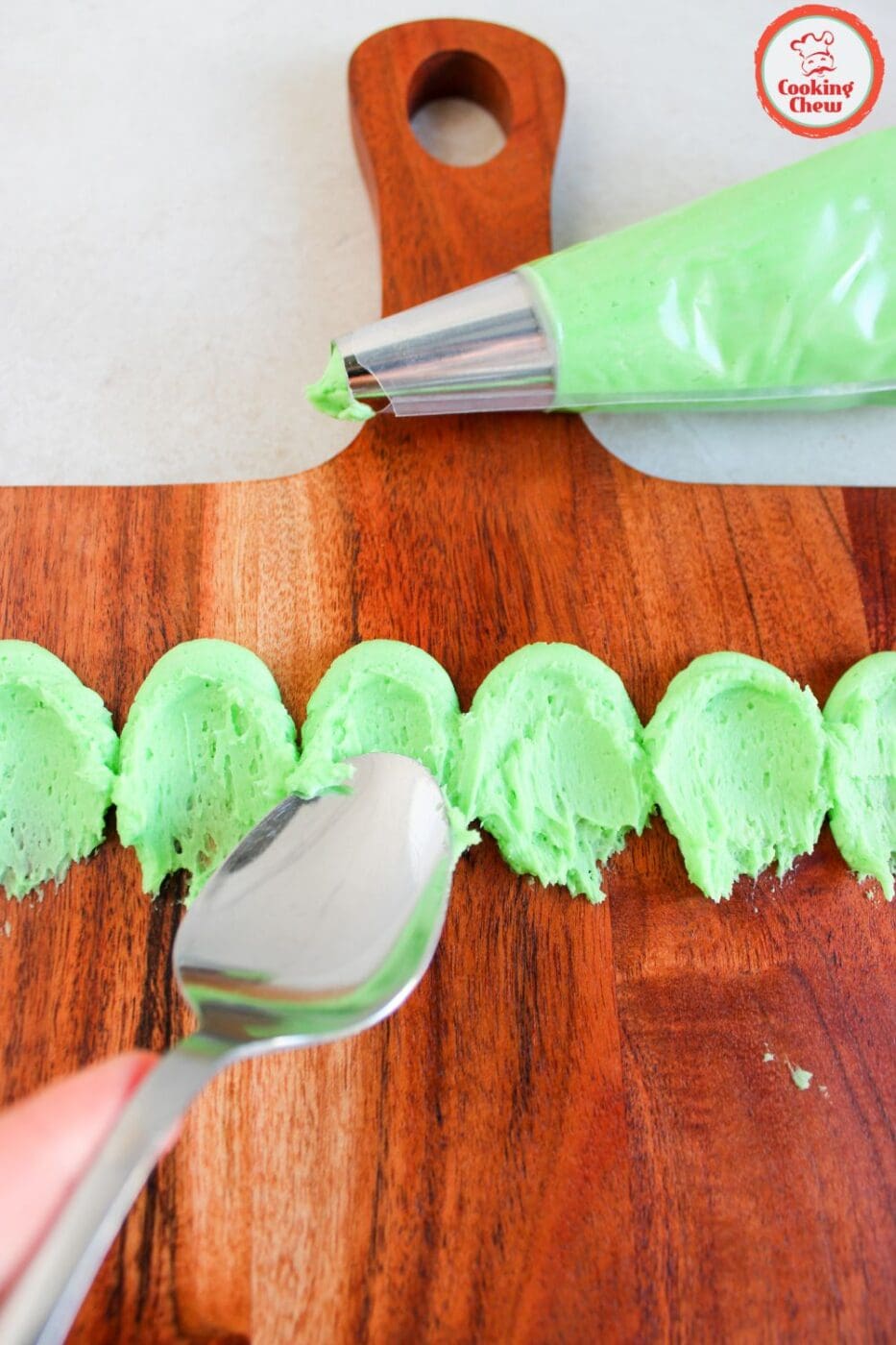 Grinch-inspired buttercream board, a fun and festive Christmas dessert.