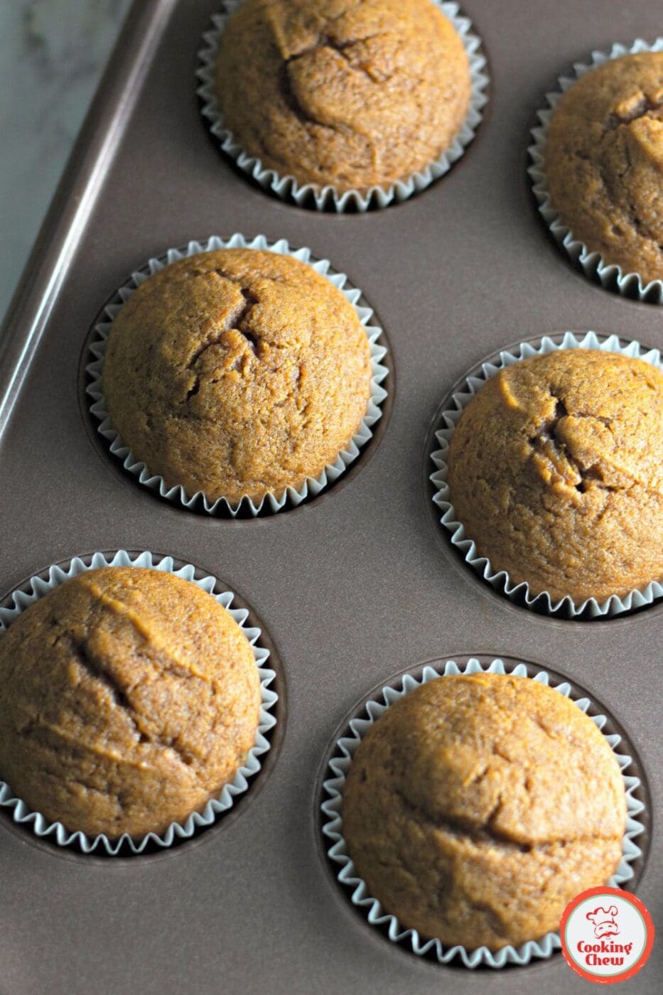 Homemade spiced pumpkin cupcakes with cream cheese frosting for autumn.