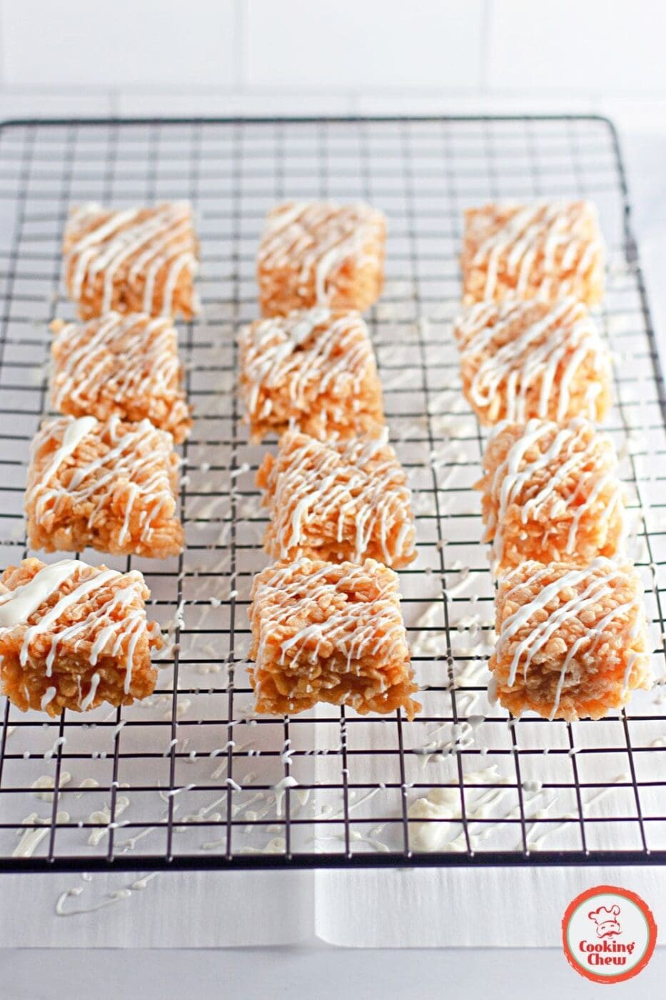 Pumpkin spice Rice Krispie treats with white chocolate for a festive dessert.