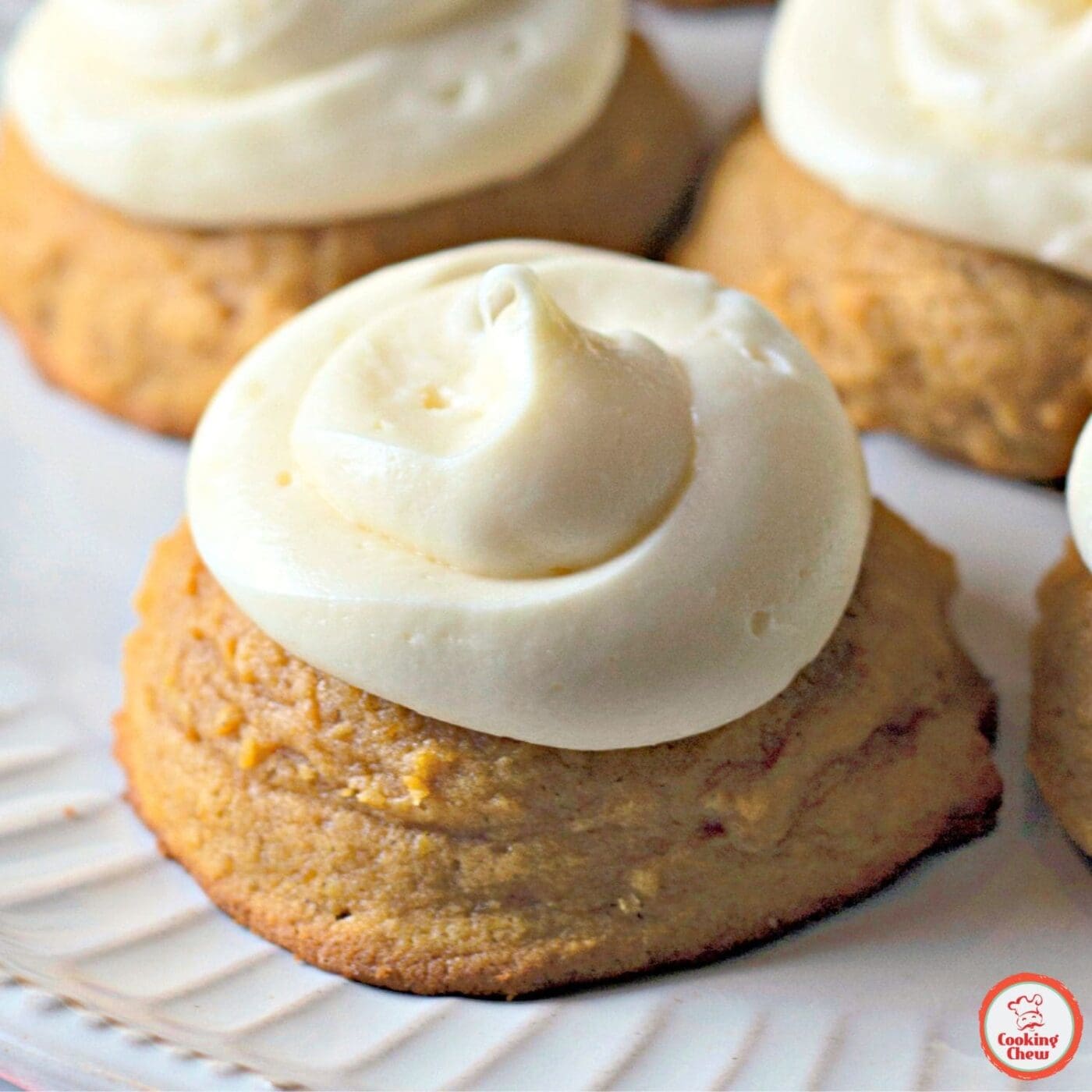 Soft pumpkin cookies with cream cheese frosting, a delicious fall dessert.