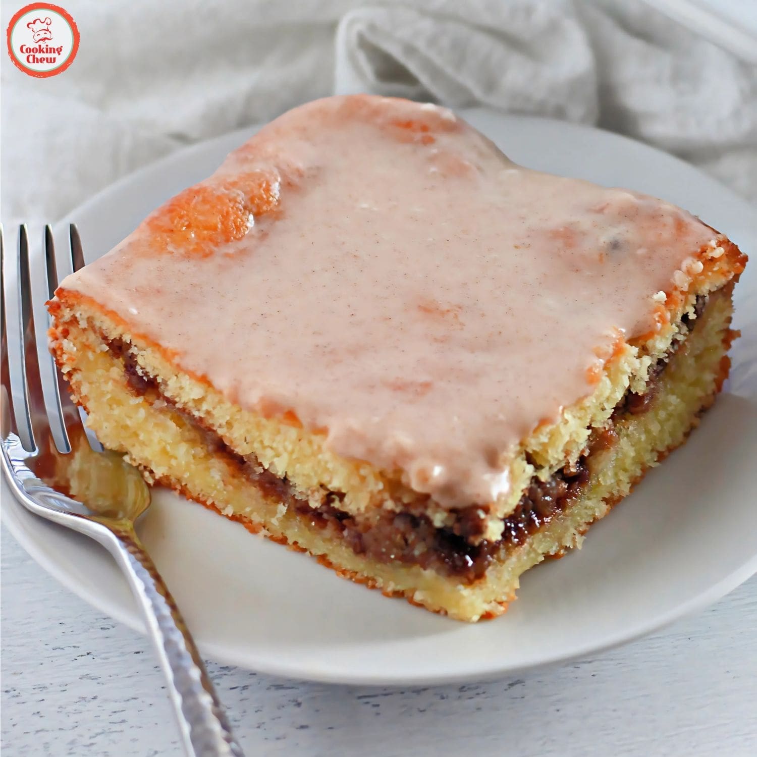 Sweet honey bun cake with gooey cinnamon layers and a glaze.
