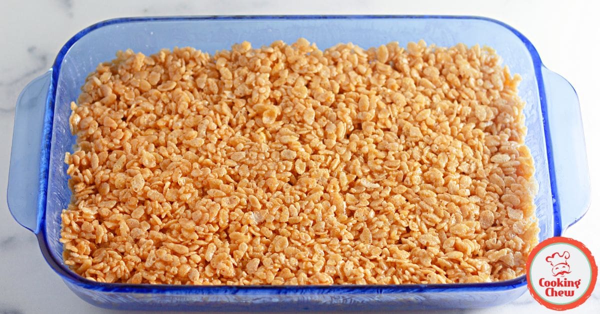 Thanksgiving pumpkin spice Rice Krispie treats with white chocolate drizzle.