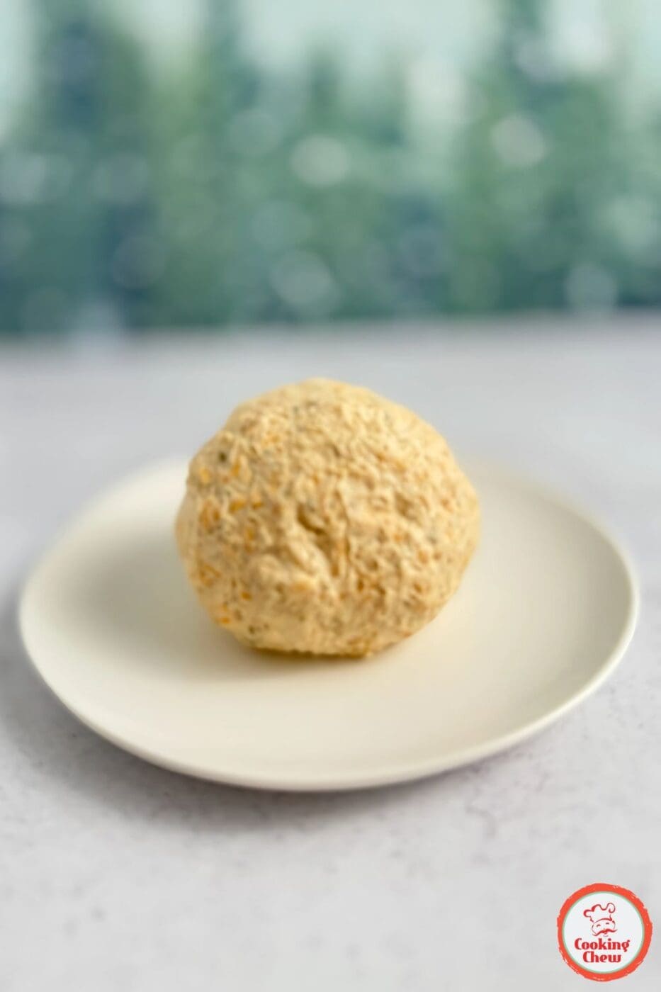 An easy-to-make cheese ball with pomegranate seeds, perfect for holiday parties.