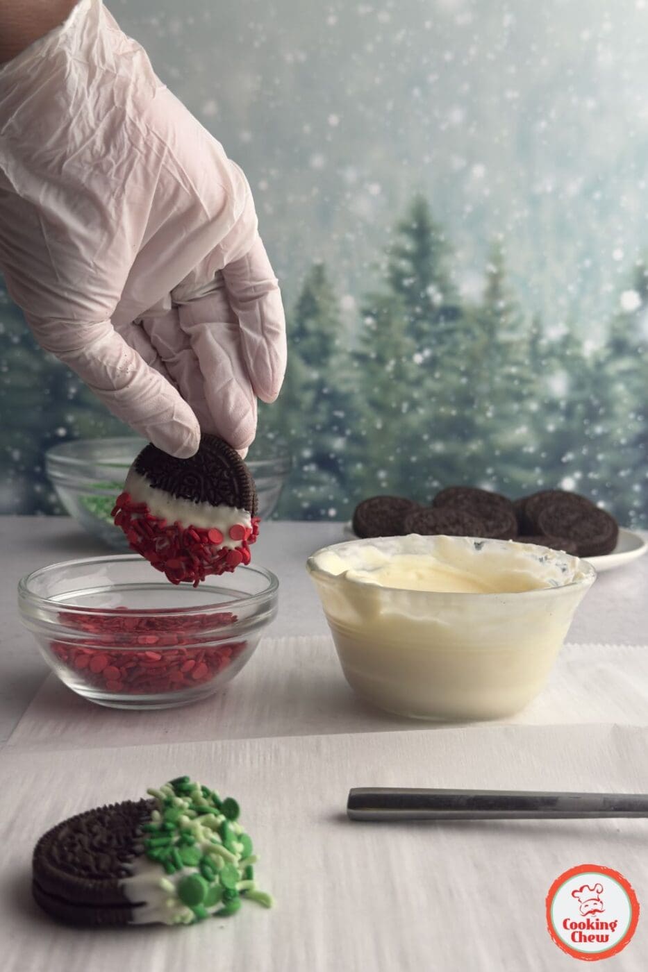Chocolate-covered Oreos decorated with red and green sprinkles for Christmas.