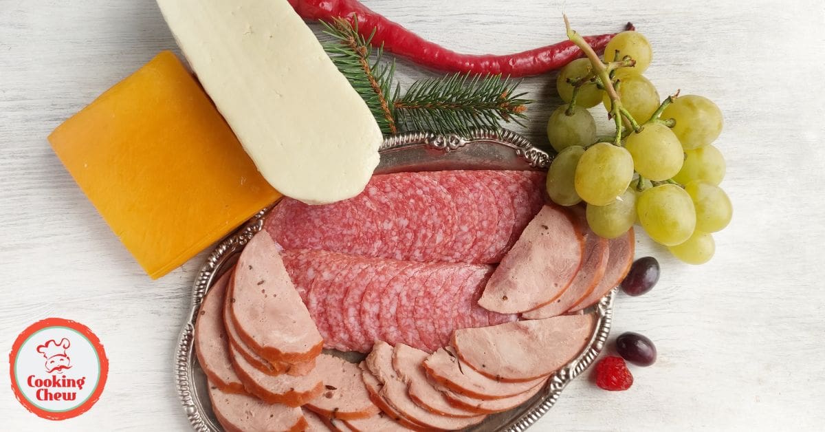 A festive Grinch-themed charcuterie board with Christmas treats for holiday parties.