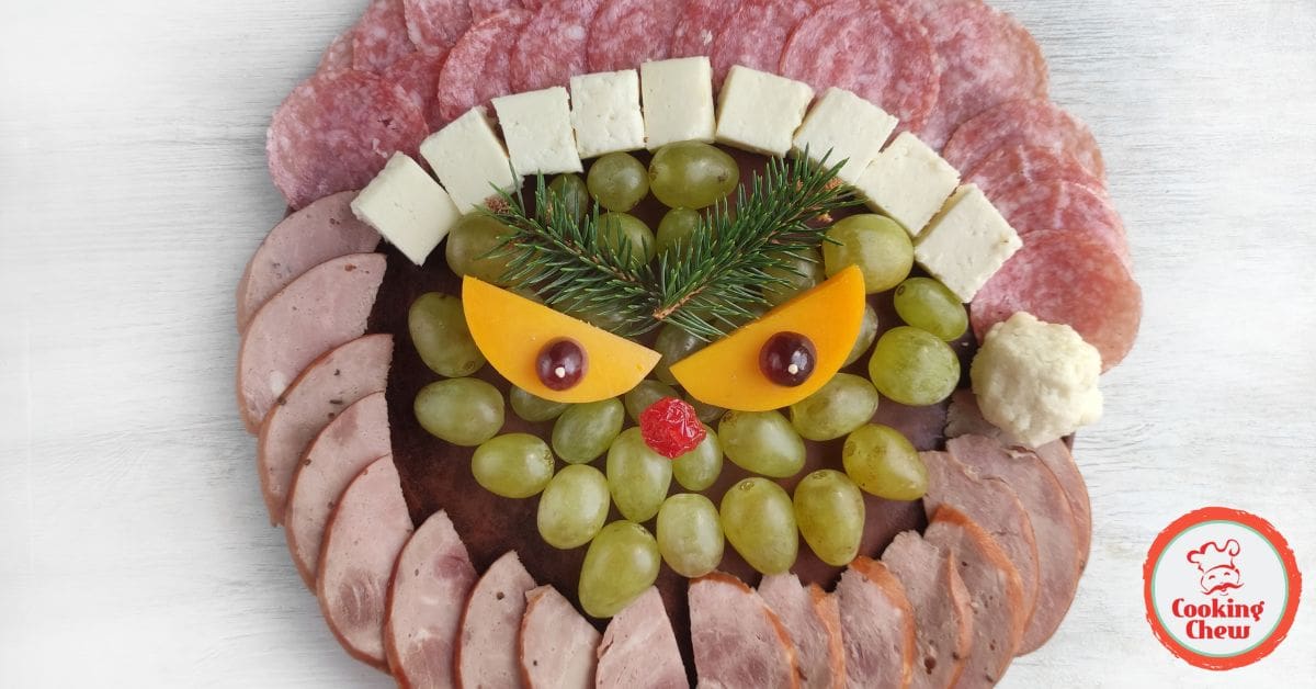 A creative Grinch-themed grazing board with Christmas-themed snacks and treats