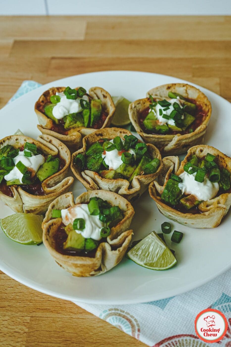 Close-up of finger foods like mini tacos, sliders, and wings perfect for Super Bowl parties.