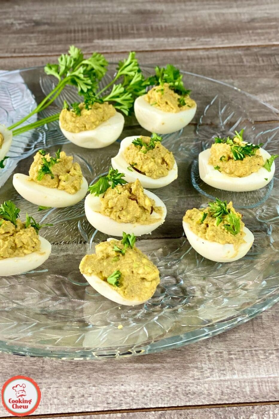A plate of creamy avocado deviled eggs, garnished with paprika and fresh herbs, offering a fresh and healthy twist on a classic appetizer.