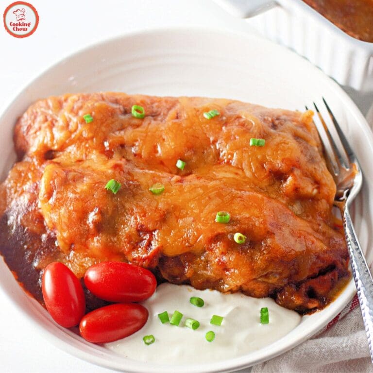 Cheesy beef enchiladas with sauce, served fresh from the oven.