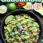 Chunky guacamole served in a rustic bowl surrounded by tortilla chips and fresh vegetables.