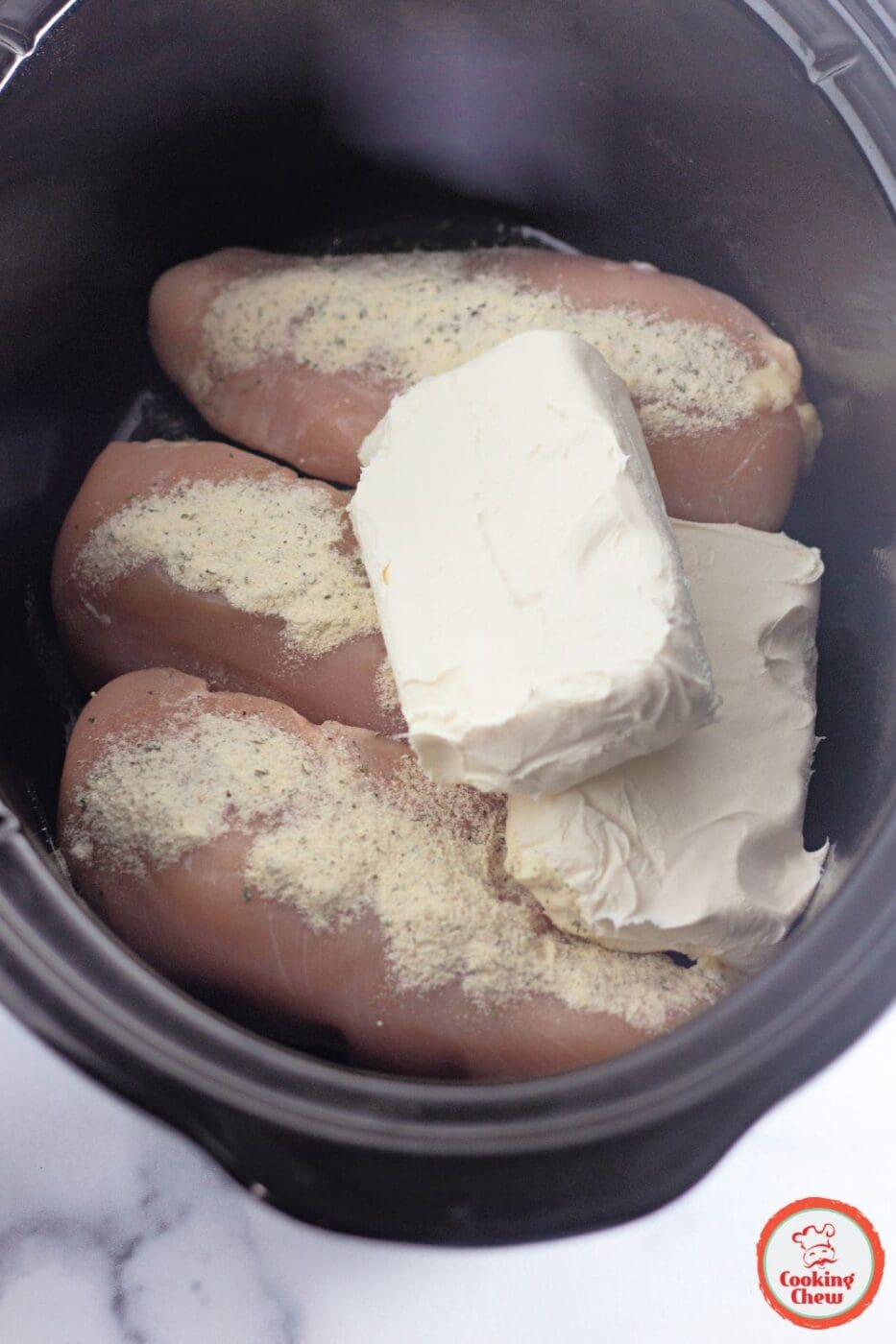 Crack chicken served as a sandwich filling on toasted buns.