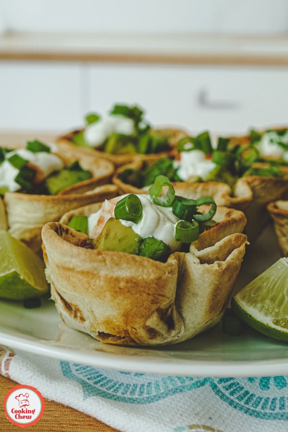 Mini taco cups filled with seasoned ground beef, cheese, and toppings, offering a delicious and creative spin on traditional tacos. Perfect for parties and family dinners.