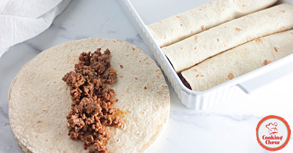 A casserole of beef enchiladas with cheese and sauce, ideal for families.