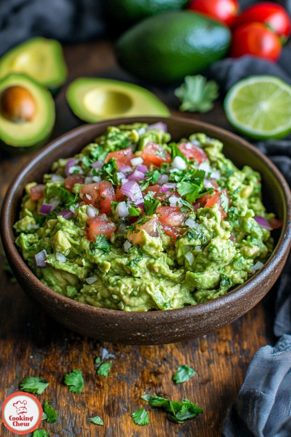 A vibrant bowl of chunky guacamole with fresh ingredients like avocados, tomatoes, onions, and cilantro, ready to serve with tortilla chips.
