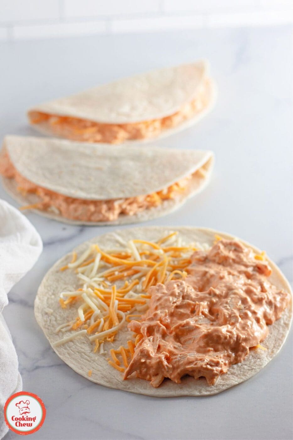 Crispy quesadillas filled with buffalo chicken and served with dipping sauces.