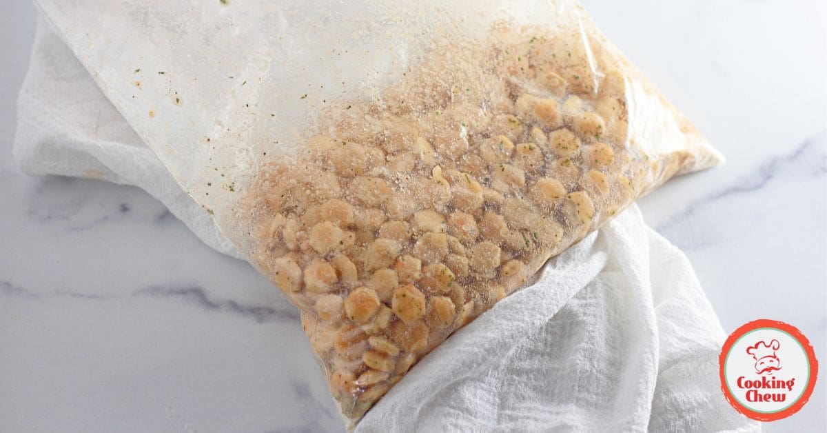 A close-up of homemade ranch oyster crackers in a rustic serving bow
