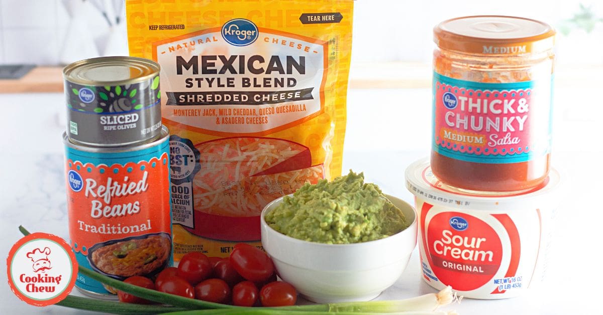 Clear cups filled with layers of guacamole, salsa, and sour cream.