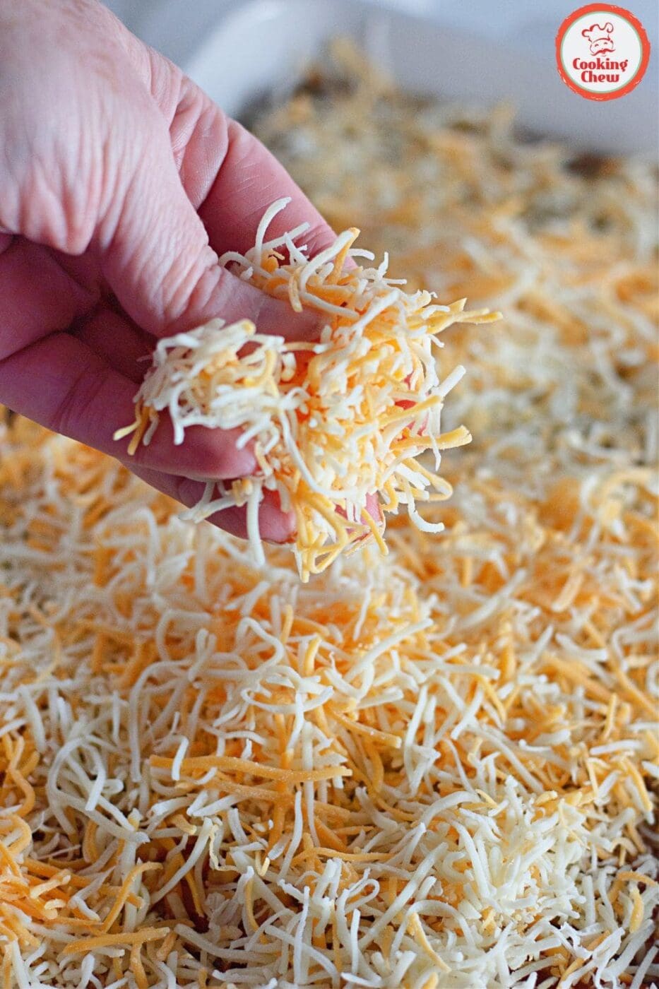 Prepped beef enchiladas in a baking dish, ready for the oven.