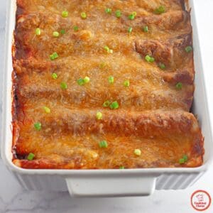 Delicious beef enchiladas with gooey cheese and red enchilada sauce.