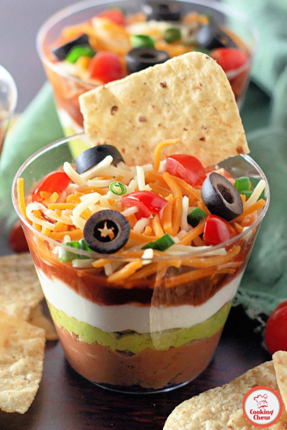 Delicious mini 7 layer dip cups, a perfect no-cook party snack.