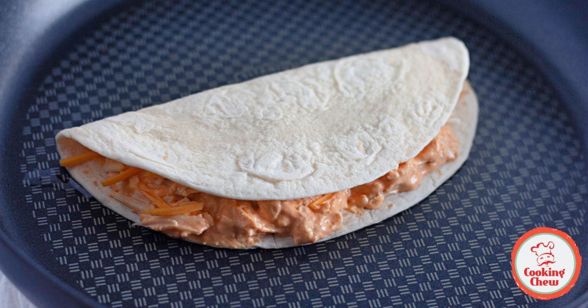 A quick dinner of buffalo chicken quesadillas served with fresh veggies.