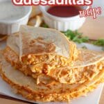 A golden quesadilla with buffalo chicken filling, garnished with parsley.