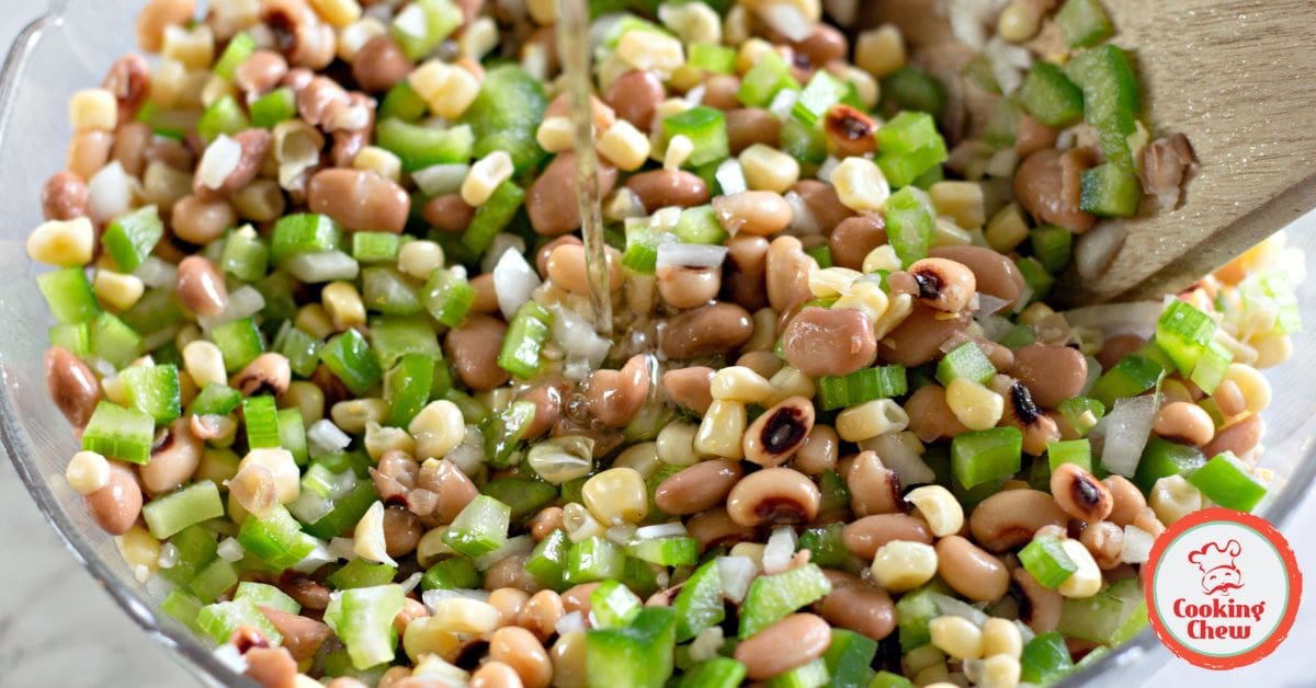 A summer-perfect cowboy caviar salad featuring fresh vegetables, beans, and a tangy dressing.