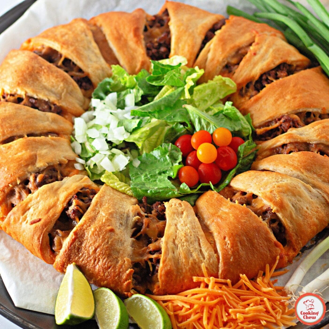 A baked taco crescent ring with ground beef and melted cheese.