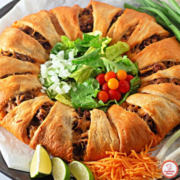 A baked taco crescent ring with ground beef and melted cheese.