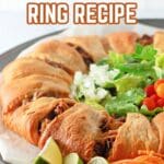 Crescent roll taco ring served as a party appetizer with salsa and toppings.
