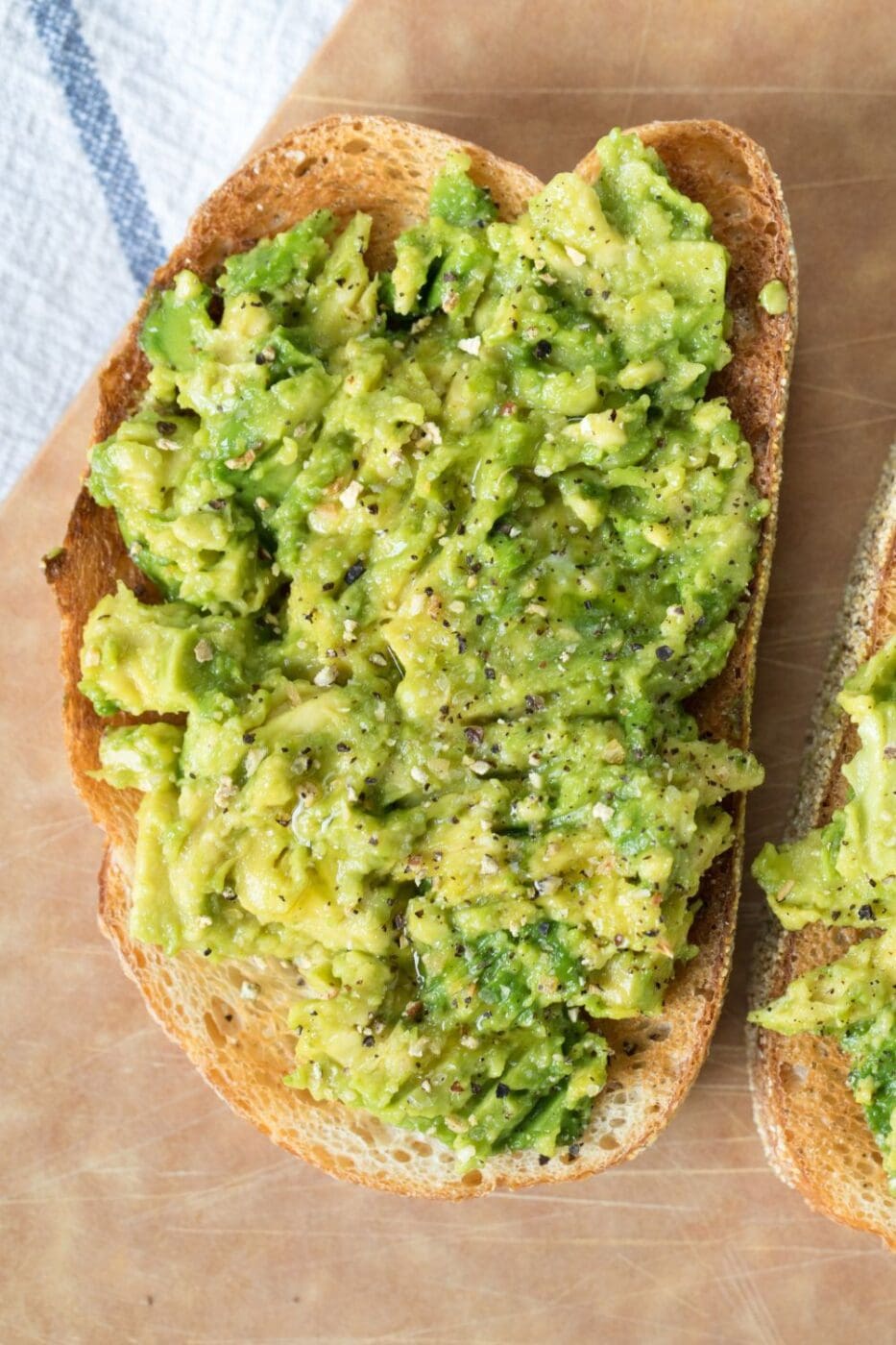 A beautifully plated avocado toast topped with fresh ingredients, perfect for a healthy breakfast.