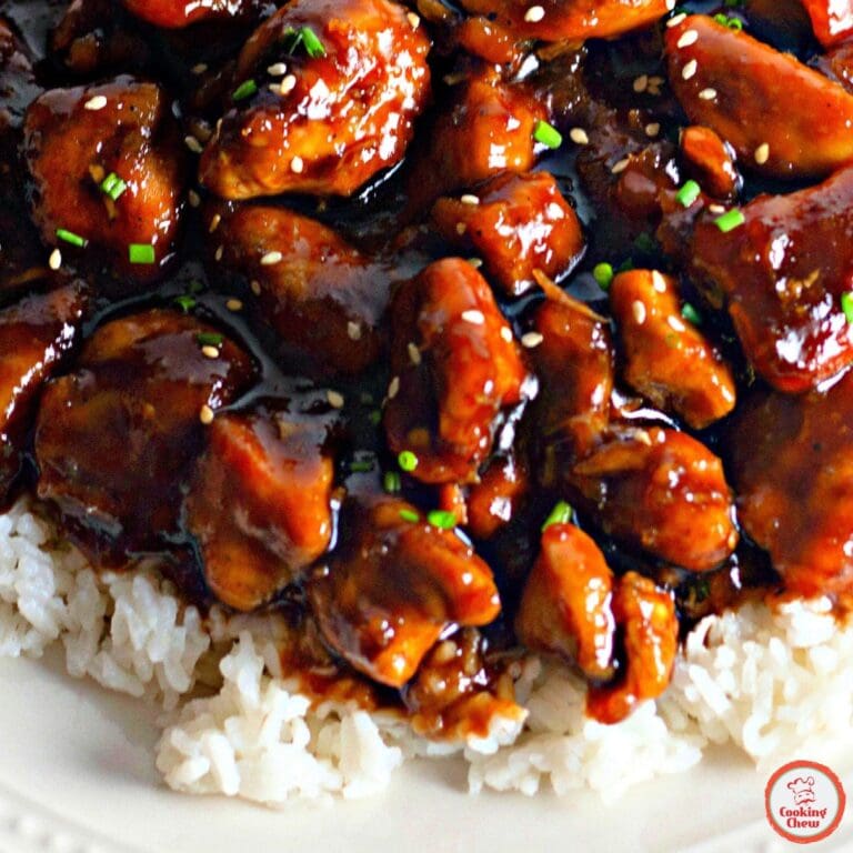 A plate of bourbon chicken with rice and broccoli on the side.
