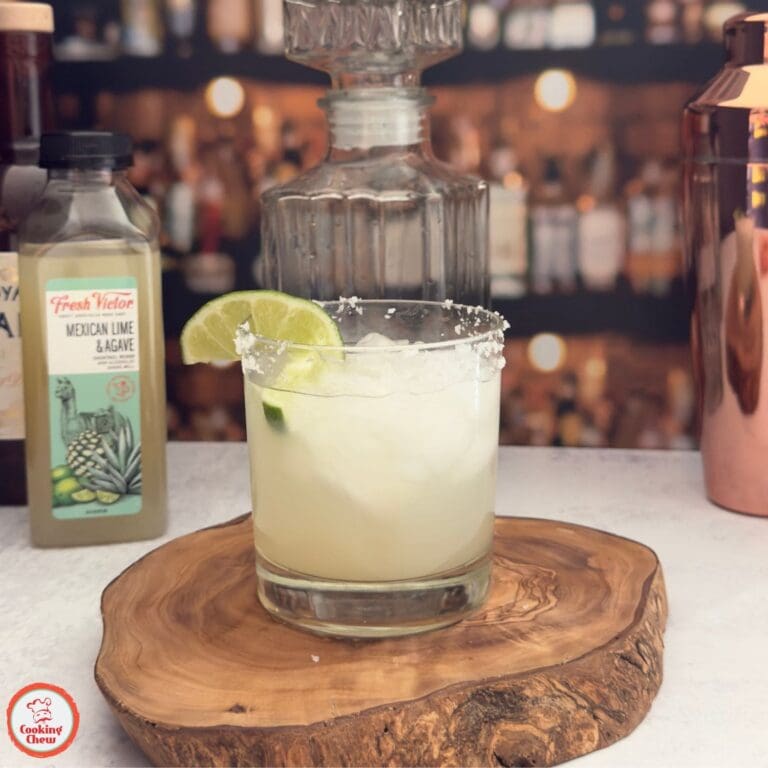 A chilled margarita on the rocks with a salted rim and lime garnish, ready to enjoy.