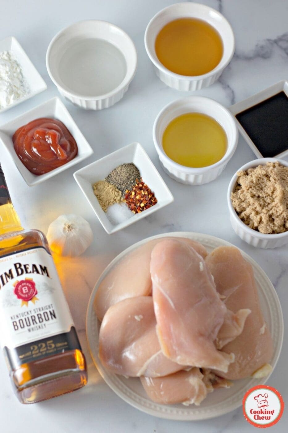 A serving of bourbon chicken over steamed rice with sesame seeds.