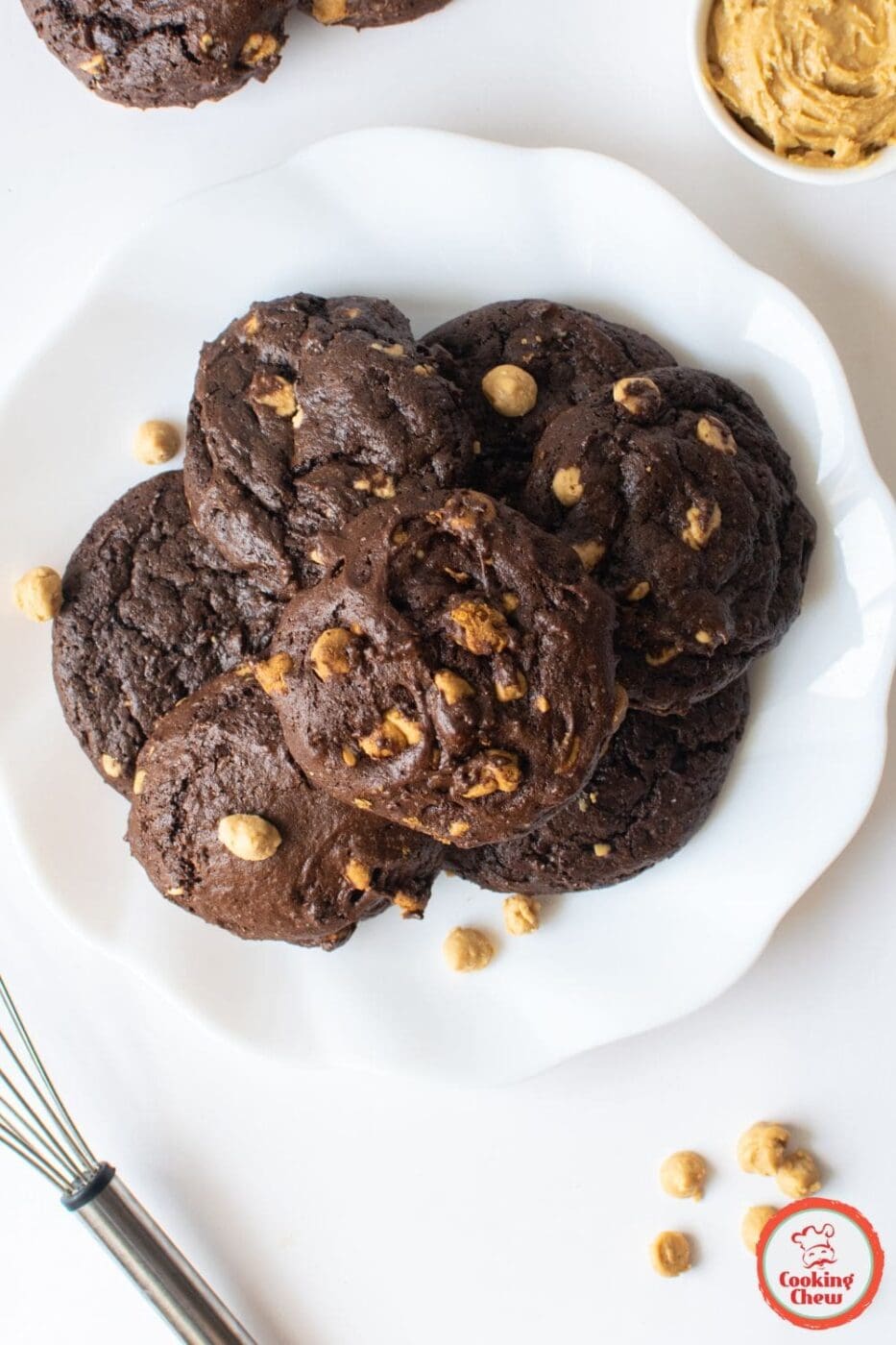 A plate of soft chocolate peanut butter cookies made with cake mix, stacked and ready to enjoy.