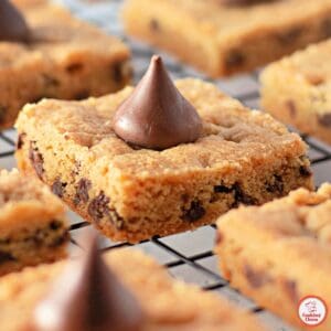 A tray of freshly baked peanut butter cookie bars, cooling on the counter.