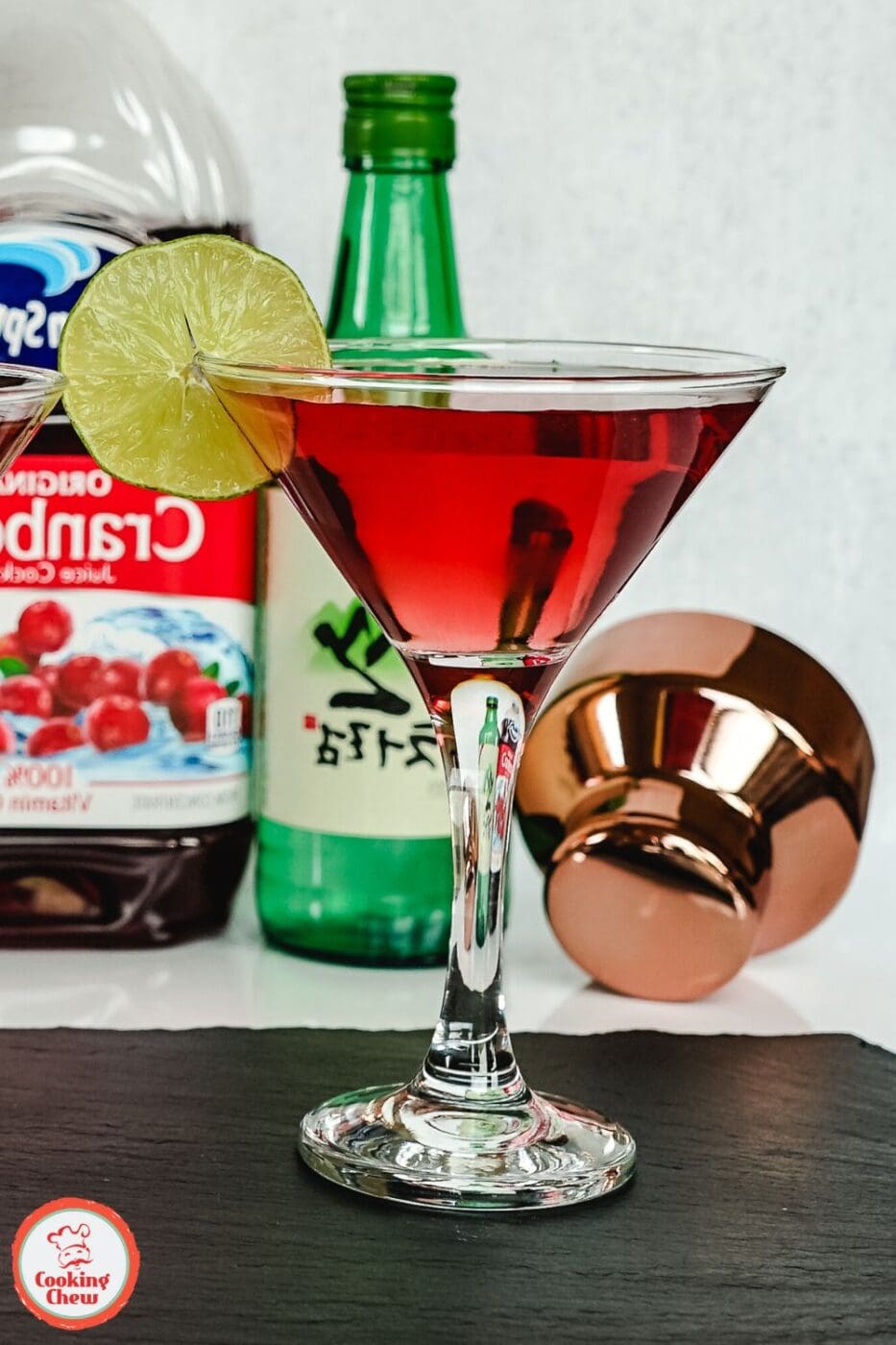 A refreshing Soju Cape Cod cocktail, made with cranberry juice, Soju, and a slice of lime, served in a highball glass.