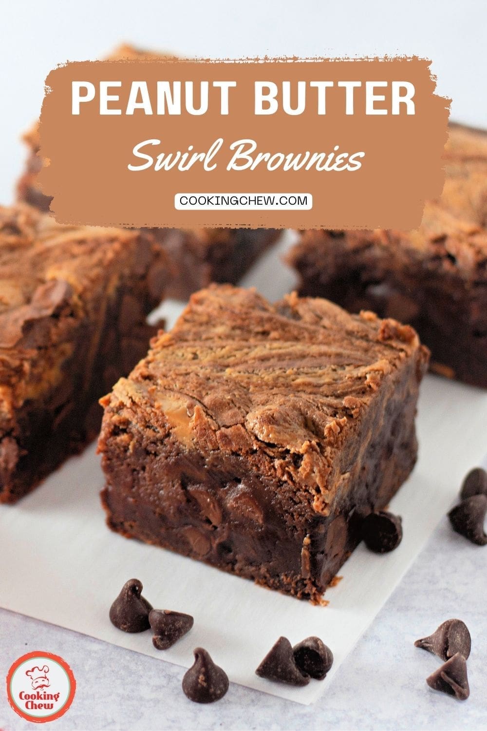 A close-up of thick, fudgy peanut butter swirl brownies with a glossy finish.